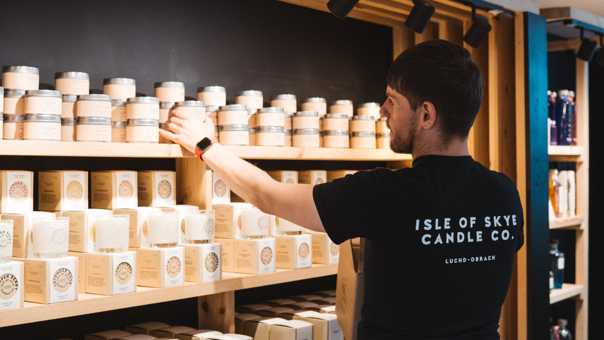 Kenneth restocking candles 